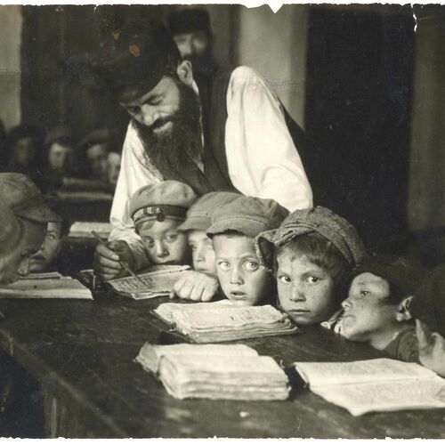 <p>A boys’ cheder in session. The teacher uses a special pointer to teach the Hebrew alphabet.</p>
<p>Lublin, Poland, 1924.</p>
<p>Courtesy of YIVO.</p>