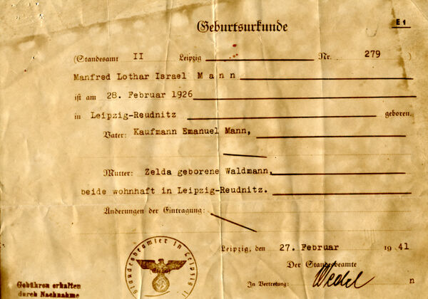 An official document featuring German writing and an ink stamp of an eagle with a swastika.