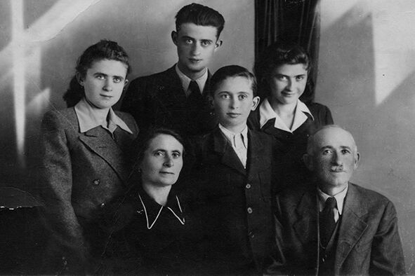 The Fischer family before the occupation of Hungary. Standing in back, left to right: Klara, Endre, Tibor and Zsuzsanna. In front: their mother, Gizella, and their father, Ervin. Kisvárda, Hungary, 1942.