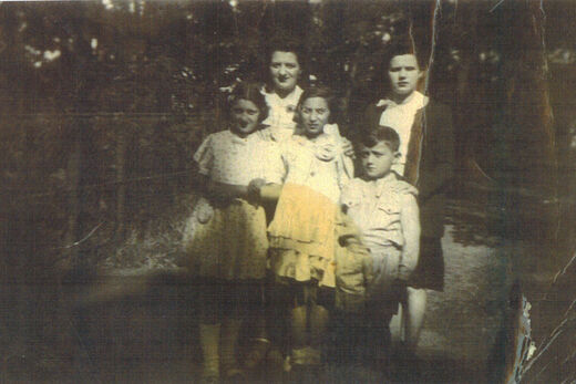 4a Taken on August 16 1943 in Brou with Mme Leroux and her daughter Edith back row and me my friend marcel and my brother Albert front row