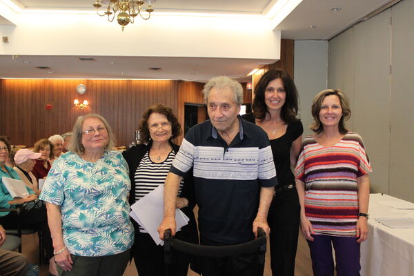 Tibor (centre) at the Sustaining Memories celebration. From left to right: writing partner Helena Adler, Tibor's wife, Vera, Tibor, and their family members. Toronto, 2013.
