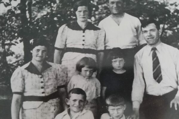 Jacob and his family. Standing in back: Jacob’s mother, Rachel, and father, Yachel. In the middle row, from left to right: Jacob’s aunt Leah; Jacob’s brother Yossi and sister, Ethel; Jacob’s uncle Moshe. Front row, from left to right: Jacob’s brother, Elli, and Jacob. Lodz, 1938.