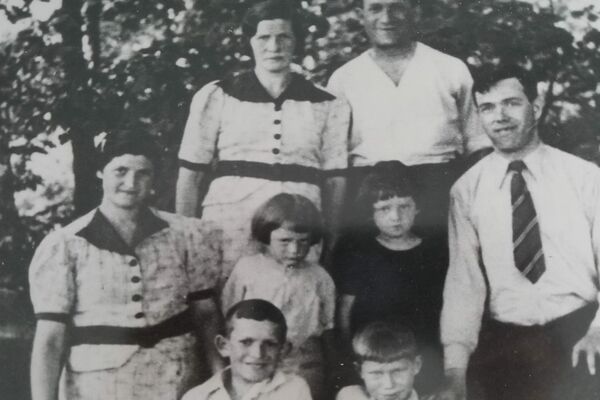 Jacob (in front, right) and his family. Standing in back: Jacob’s mother, Rachel, and father, Yachel. In the middle row, from left to right: Jacob’s aunt Leah; Jacob’s brother Yossi and sister, Ethel; Jacob’s uncle Moshe. In front, Jacob’s brother, Elli (left), and Jacob. Lodz, Poland, 1938.