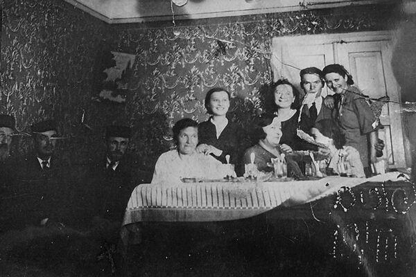 Nancy’s family at Purim. Her grandfather Shimshon is at the far left; her father, Beryl, is third from the left. 1935.