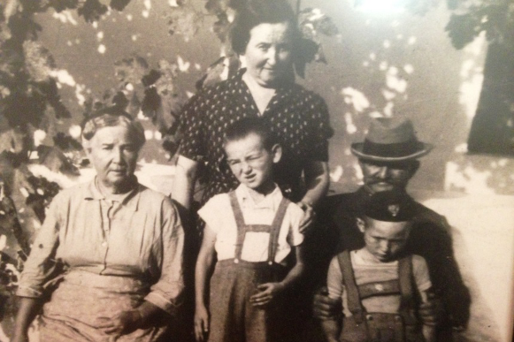 George (front, far right) with members of his family before the war. In back: George’s aunt Margo. In front, left to right:  George’s maternal grandmother, Ilona; his cousin Laci; his maternal grandfather, Mondi; and George. Szűcsi, Hungary, circa 1936.