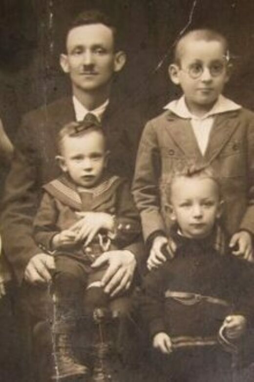 Mendel (front row, left) on his father’s lap, with Mendel’s cousin Shalom (top, right) and Mendel’s brother Shmuel (front, right). Nowy Sącz, Poland, circa 1928.