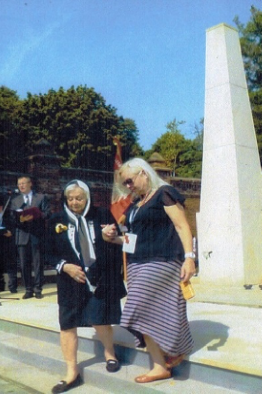 Freda (left) at the Lodz memorial to the victims of the Holocaust, located in a Jewish cemetery. Lodz, Poland, 2014.