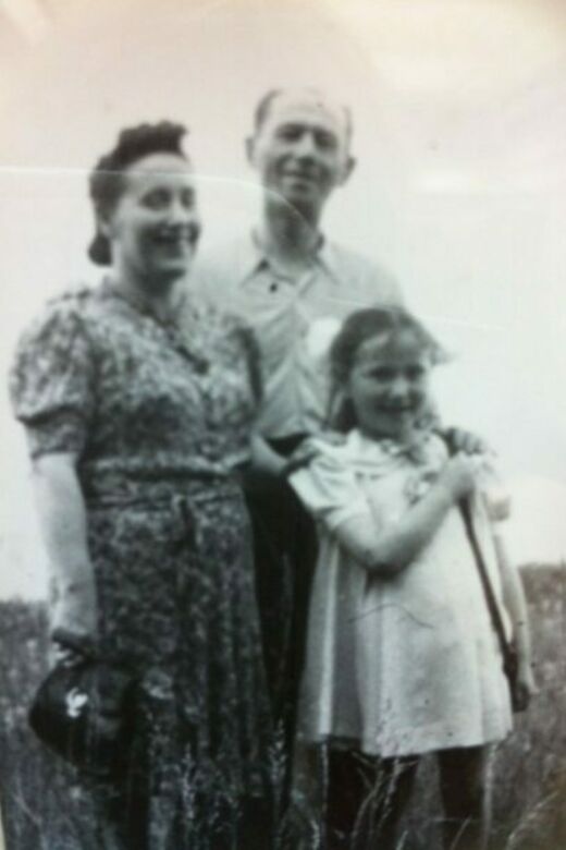 Mina and her parents after the war. Poland, circa 1945.