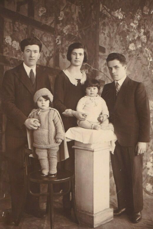 Bracha as a baby (seated), with her parents, Mania (centre) and Chaim Silber (right), her sister Chava (standing), who died before the war, and family friend Yoshe Meller (left), who took most of their family photographs. Antwerp, Belgium, circa 1931.